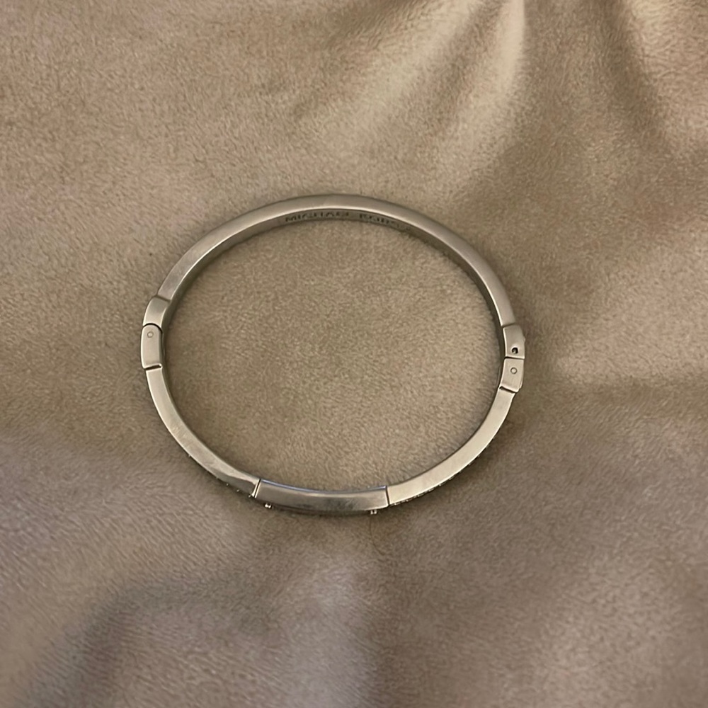 **SOLD ELSEWHERE** Michael Kors - Silver bangle with Jewels. Side clip